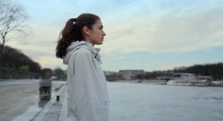 An athlete looking over to the Seine