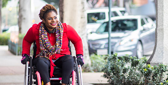 smiling woman in a wheelchair