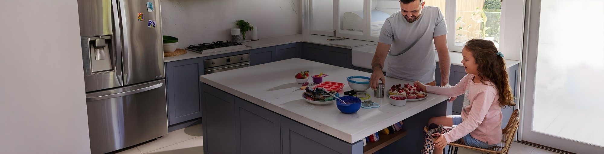 Father and daughter playing in kitchen